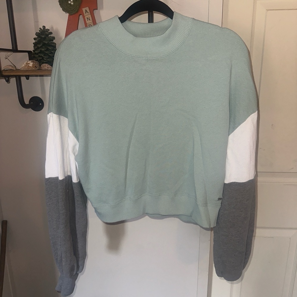 Women’s Hollister Sweater. Size Small. Green with white and grey sleeves.